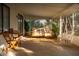 Inviting outdoor patio space with a hanging swing chair and comfortable seating and natural light at 7412 S Elm St, Tempe, AZ 85283