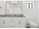 Beautiful bathroom features double sinks and granite countertop at 7694 E Minnezona Ave, Scottsdale, AZ 85251