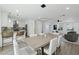 Bright open-concept space featuring a modern kitchen, dining area, and living room at 7694 E Minnezona Ave, Scottsdale, AZ 85251