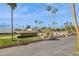 Exterior view of a building with palm trees, lawn, and a parking lot at 7694 E Minnezona Ave, Scottsdale, AZ 85251