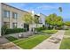 Charming front exterior featuring mature trees, meticulous landscaping, and a welcoming pathway to the home at 7694 E Minnezona Ave, Scottsdale, AZ 85251