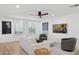 Bright living room with ample natural light, modern furnishings, and stylish decor for comfortable living at 7694 E Minnezona Ave, Scottsdale, AZ 85251