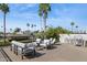 Rooftop deck with comfortable seating and views of palm trees and blue skies at 7694 E Minnezona Ave, Scottsdale, AZ 85251