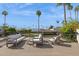 Relaxing rooftop deck with comfortable seating, offering stunning views of the surrounding area and palm trees at 7694 E Minnezona Ave, Scottsdale, AZ 85251