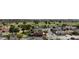 Panoramic aerial view of homes in a suburban neighborhood with a golf course at 8512 W Tuckey Ln, Glendale, AZ 85305
