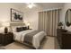 Comfortable bedroom featuring neutral paint, carpet flooring, and tasteful decor at 8512 W Tuckey Ln, Glendale, AZ 85305