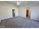 Large primary bedroom showcasing carpet, lighting, and spacious layout at 8512 W Tuckey Ln, Glendale, AZ 85305