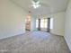 Spacious primary bedroom with large window and neutral carpet at 8512 W Tuckey Ln, Glendale, AZ 85305