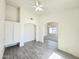 Bonus room with tile flooring, archways, and ceiling fan at 8512 W Tuckey Ln, Glendale, AZ 85305