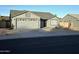 Well-maintained single story home with a two-car garage and a xeriscaped front yard at 8512 W Tuckey Ln, Glendale, AZ 85305