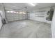 Spacious two-car garage with white walls and plenty of storage space at 8512 W Tuckey Ln, Glendale, AZ 85305