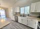 Bright kitchen featuring white cabinets, stainless steel appliances, and an island at 8512 W Tuckey Ln, Glendale, AZ 85305