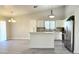 Bright kitchen featuring white cabinets, stainless steel appliances, and an island at 8512 W Tuckey Ln, Glendale, AZ 85305