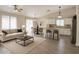 Open concept living room and kitchen provides ample seating and cooking spaces at 8512 W Tuckey Ln, Glendale, AZ 85305