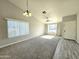 Inviting living room featuring vaulted ceilings, a ceiling fan and tile entryway at 8512 W Tuckey Ln, Glendale, AZ 85305