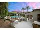 Backyard featuring a pool, outdoor kitchen, and picturesque mountain views at 8601 N 59Th Pl, Paradise Valley, AZ 85253