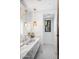 Bathroom with marble vanity, stylish lighting, and modern fixtures at 8601 N 59Th Pl, Paradise Valley, AZ 85253