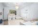 Charming bedroom with a playful tent, hanging swings, and a cozy rug under a decorative chandelier at 8601 N 59Th Pl, Paradise Valley, AZ 85253