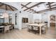 Bright, open kitchen featuring an island with seating, skylight, custom cabinets, and a breakfast nook at 8601 N 59Th Pl, Paradise Valley, AZ 85253