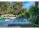 Backyard spa surrounded by lush greenery, offering a peaceful retreat at 8601 N 59Th Pl, Paradise Valley, AZ 85253