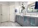 Elegant bathroom with double vanities, granite countertops, and modern fixtures at 9908 E Medina Ave, Mesa, AZ 85209