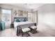 Serene bedroom with neutral decor, two large windows, soft carpeting, and stylish furnishings at 9908 E Medina Ave, Mesa, AZ 85209
