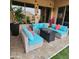 Relaxing outdoor seating area with plush cushions, a modern fire pit, and stylish decor at 9908 E Medina Ave, Mesa, AZ 85209