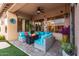 Cozy outdoor seating area with a fire pit, comfortable seating, and views of the backyard at 9908 E Medina Ave, Mesa, AZ 85209