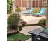 Relaxing outdoor pool deck area with comfortable lounge chairs and a modern fire pit table at 9908 E Medina Ave, Mesa, AZ 85209