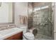 Modern bathroom featuring a spacious glass shower, vanity with sink, and updated fixtures at 10713 N 124Th Pl, Scottsdale, AZ 85259