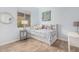 Bright bedroom features a platform bed with storage and a large window allowing ample light at 10713 N 124Th Pl, Scottsdale, AZ 85259