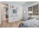 Light-filled bedroom boasting stylish decor, a large window, and neutral paint to create a calm ambiance at 10713 N 124Th Pl, Scottsdale, AZ 85259