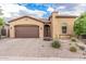 Home with desert landscaping, an arched entry and a two-car garage at 10713 N 124Th Pl, Scottsdale, AZ 85259