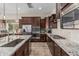 Beautiful open kitchen featuring stainless appliances, granite countertops, and tile backsplash at 10713 N 124Th Pl, Scottsdale, AZ 85259