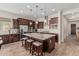 Spacious kitchen with granite counters, stainless appliances, mosaic backsplash and central island with barstool seating at 10713 N 124Th Pl, Scottsdale, AZ 85259