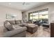 Comfortable living room with neutral tones, modern decor, wood floors, and access to the outdoor patio at 10713 N 124Th Pl, Scottsdale, AZ 85259