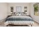 Relaxing primary bedroom with two side tables and decorative pillows on the bed at 10713 N 124Th Pl, Scottsdale, AZ 85259