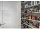 Walk-in pantry with shelving, offering ample storage space for groceries and kitchen essentials at 10713 N 124Th Pl, Scottsdale, AZ 85259