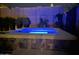 Outdoor in-ground spa with mosaic tile base and retaining wall providing a private backyard retreat at 10713 N 124Th Pl, Scottsdale, AZ 85259