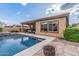 Beautiful backyard with a sparkling pool, covered patio, and built-in grill for outdoor enjoyment at 10713 N 124Th Pl, Scottsdale, AZ 85259