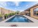Inviting backyard features a sparkling pool, raised spa, and covered patio for outdoor entertainment at 10713 N 124Th Pl, Scottsdale, AZ 85259