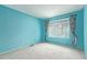 Light blue bedroom featuring plush carpet and window with curtains at 1114 W Meseto Ave, Mesa, AZ 85210