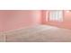 Bright, airy bedroom with large window and neutral carpeting, bathed in soft, natural light at 1114 W Meseto Ave, Mesa, AZ 85210