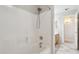 Bright bathroom featuring a tiled shower and tub combination with neutral-toned flooring at 11351 N 153Rd Dr, Surprise, AZ 85379