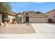 Charming single-story home with desert landscaping and a two-car garage at 11351 N 153Rd Dr, Surprise, AZ 85379