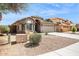 Inviting single-story home with desert landscaping and a two-car garage at 11351 N 153Rd Dr, Surprise, AZ 85379