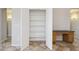 Bright hallway featuring plenty of storage in the closets and built-in desk for maximum efficiency at 11351 N 153Rd Dr, Surprise, AZ 85379