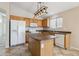 Functional kitchen features an island, white appliances, and efficient layout, creating an ideal cooking space at 11351 N 153Rd Dr, Surprise, AZ 85379