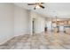 Bright living space with tiled floors seamlessly connects to other areas, offering an open and airy feel at 11351 N 153Rd Dr, Surprise, AZ 85379