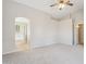Spacious main bedroom featuring neutral walls, carpet flooring, and an ensuite bathroom entrance at 11351 N 153Rd Dr, Surprise, AZ 85379